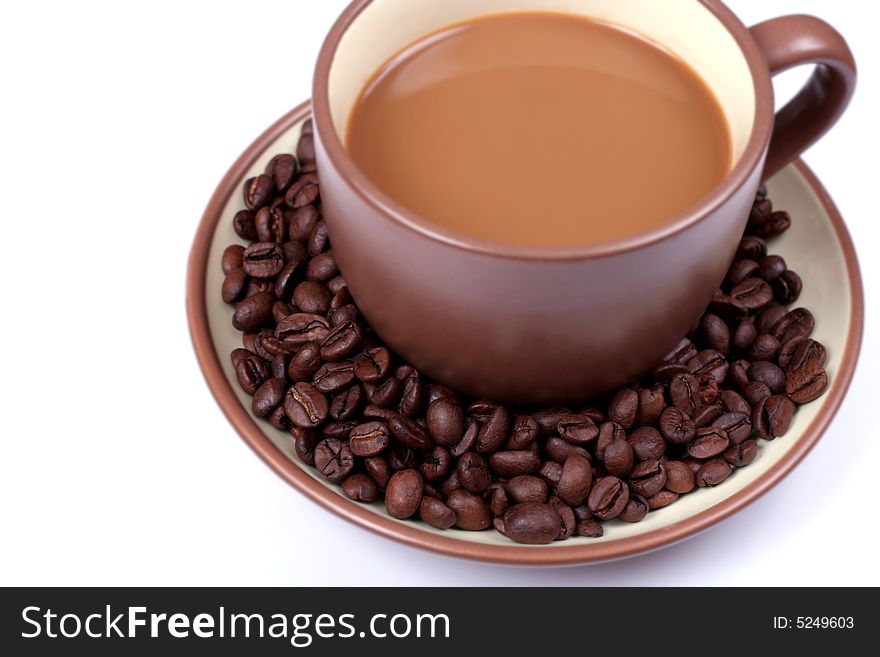 Cup of coffee and coffee beans from above. Cup of coffee and coffee beans from above