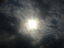 Sun Behind Clouds. Stock Photos
