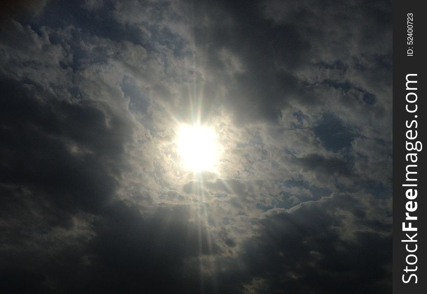 Sun Behind Clouds.