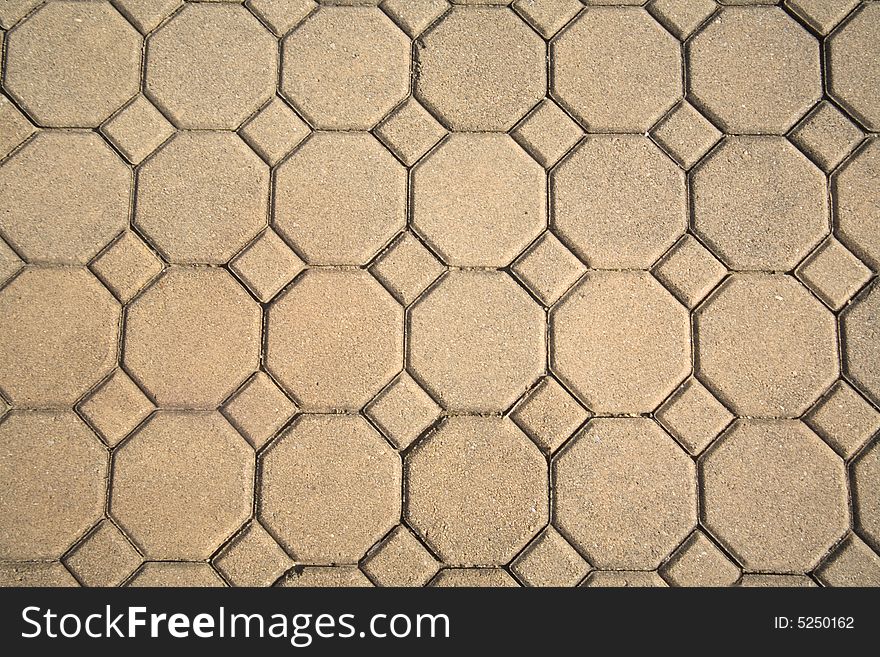 Acid stained stamped cement patio. Tan colored  modern outdoor flooring. Acid stained stamped cement patio. Tan colored  modern outdoor flooring