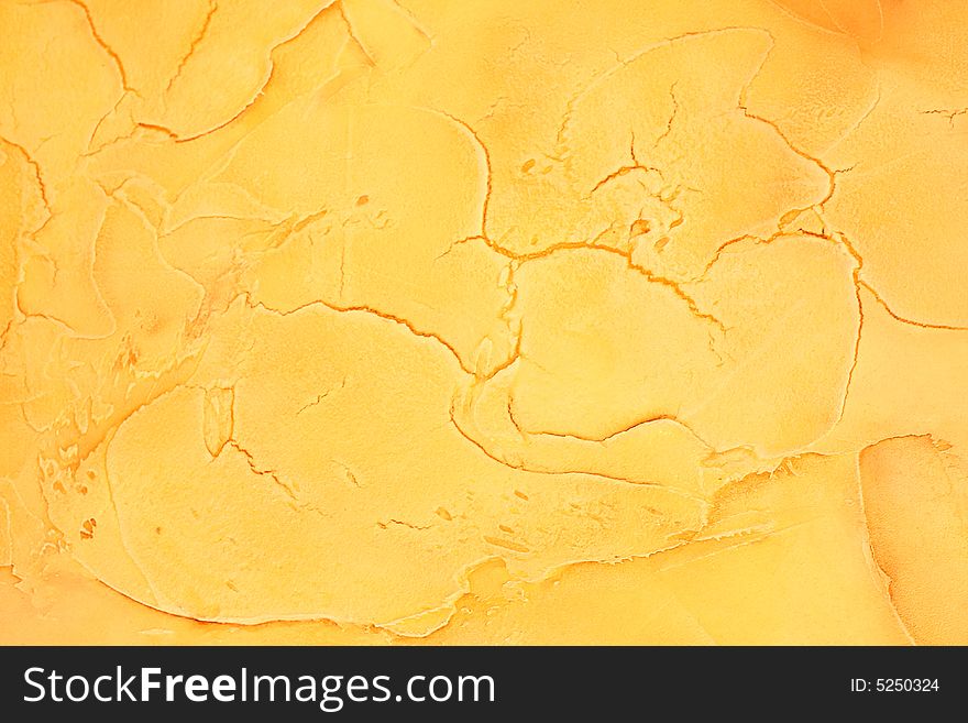 Yellow painted background with cracks