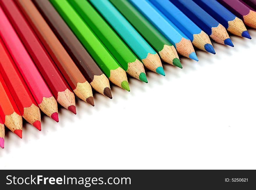 Thick colored pencils against a white background color