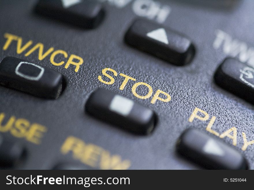 A close up of the stop button on a remote control.