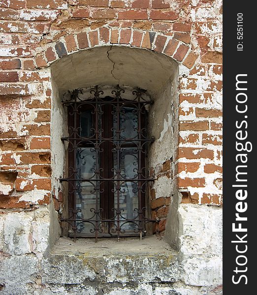 Old window in a wall of a church. Old window in a wall of a church