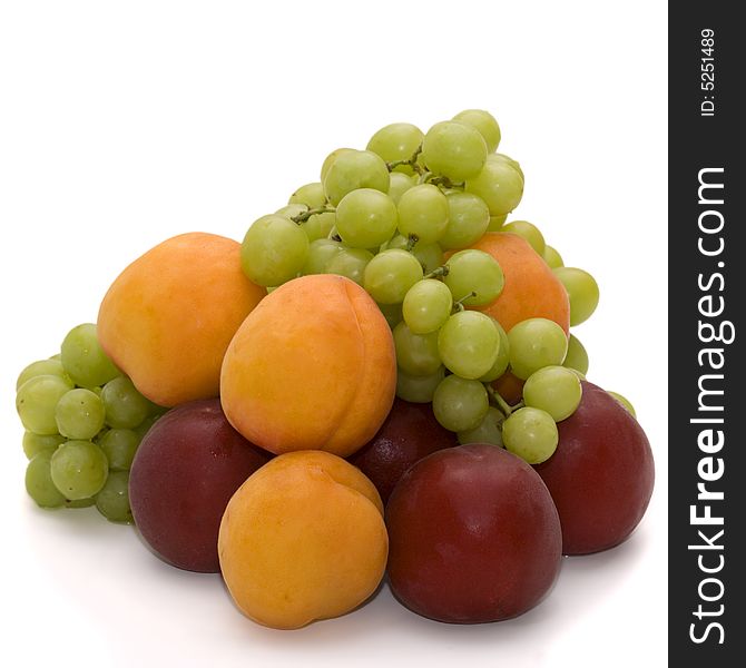 Grapes, apricots and plums isolated over white. Grapes, apricots and plums isolated over white