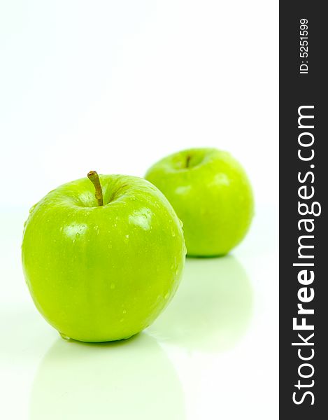 Green apples isolated against a white background