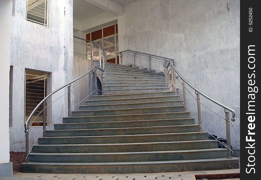 An upwards staircase in an old building. An upwards staircase in an old building