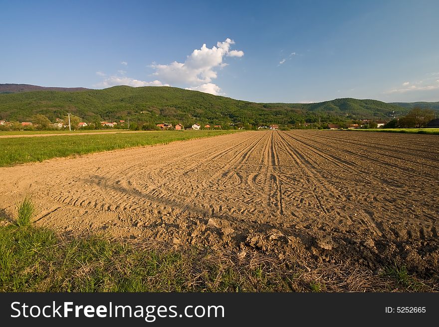 Ploughed field with mountain in the background