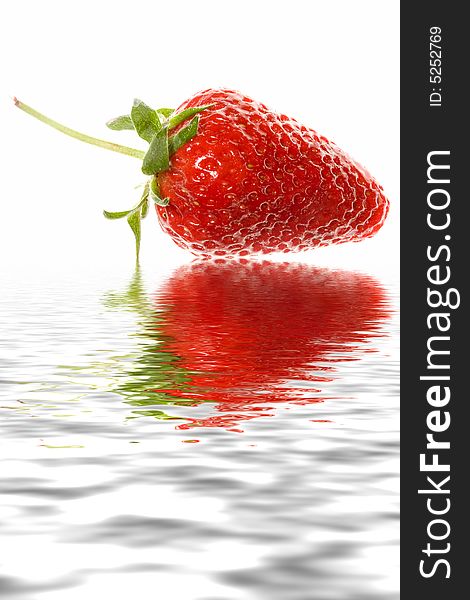 Delicious strawberry on white background with reflection in water