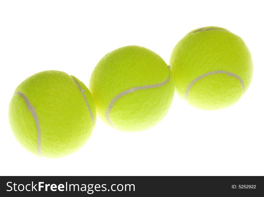 Three tennis balls isolated on white