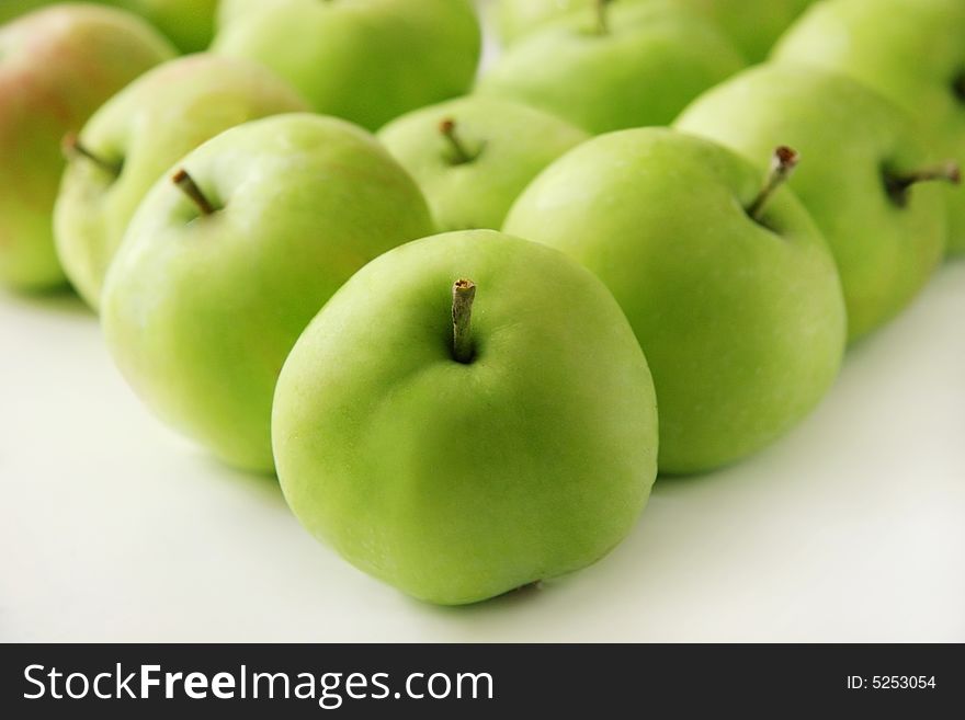 Green apples on a white background. Green apples on a white background.
