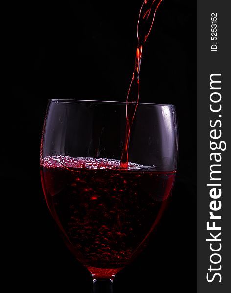 Red wine falling in a glass. Red wine falling in a glass