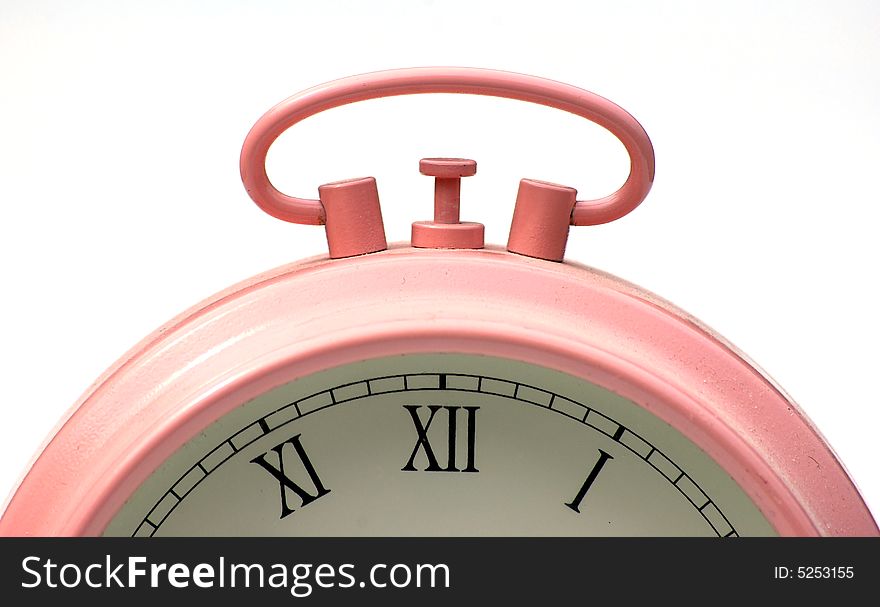 Close up shot of a pink alarm clock. Close up shot of a pink alarm clock