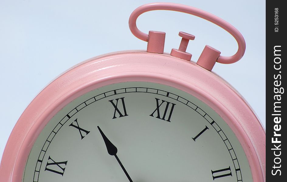 Close up shot of a pink alarm clock. Close up shot of a pink alarm clock