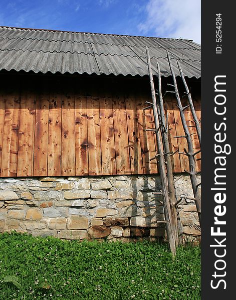 Bright wooden cow-house and blue sky