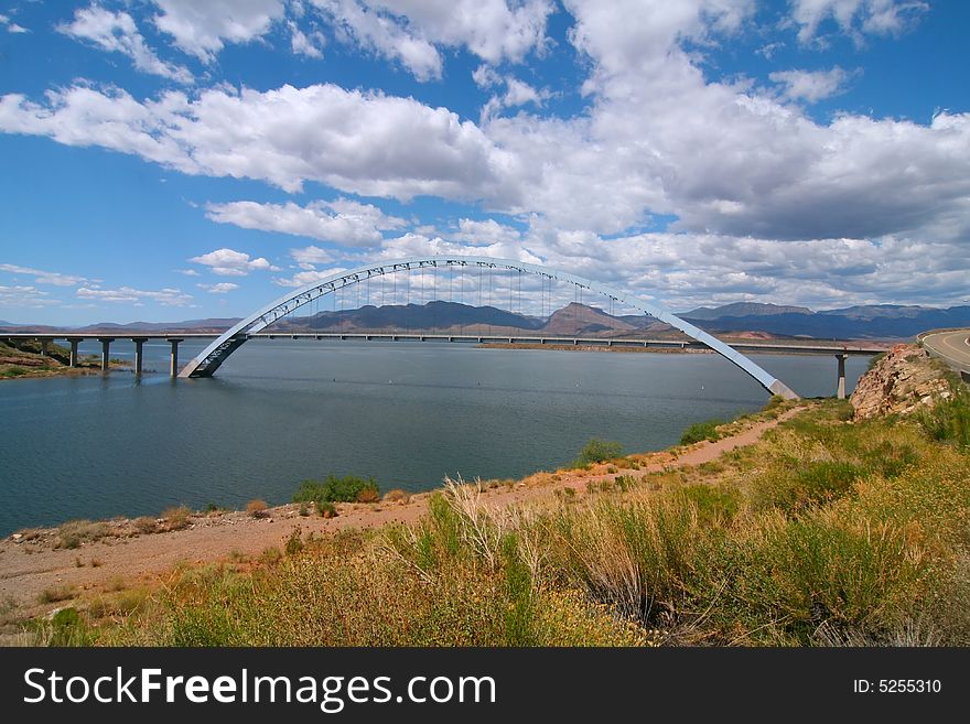 Arch Bridge with blue skys and puffy clouds. Arch Bridge with blue skys and puffy clouds