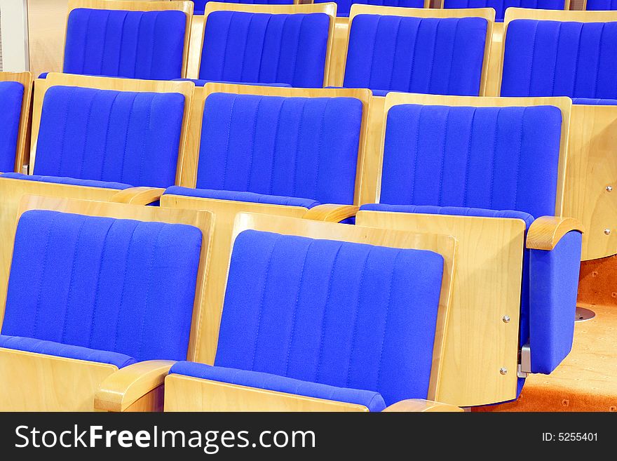 Cinema chairs in rows with blue textile. Cinema chairs in rows with blue textile