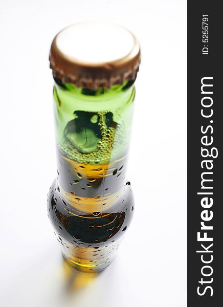 Wide angle shot of bottle of beer on white background