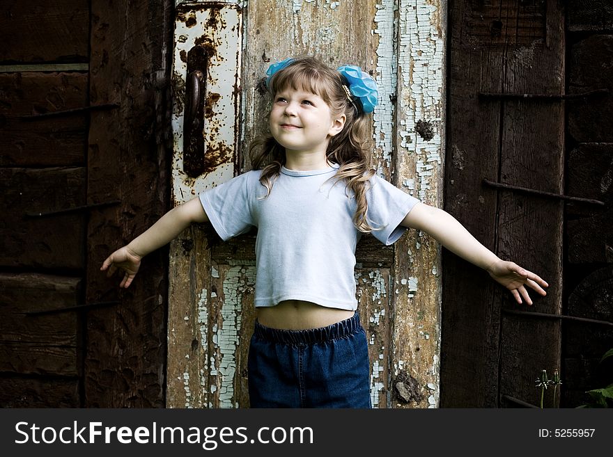 An image of girl at old door. An image of girl at old door