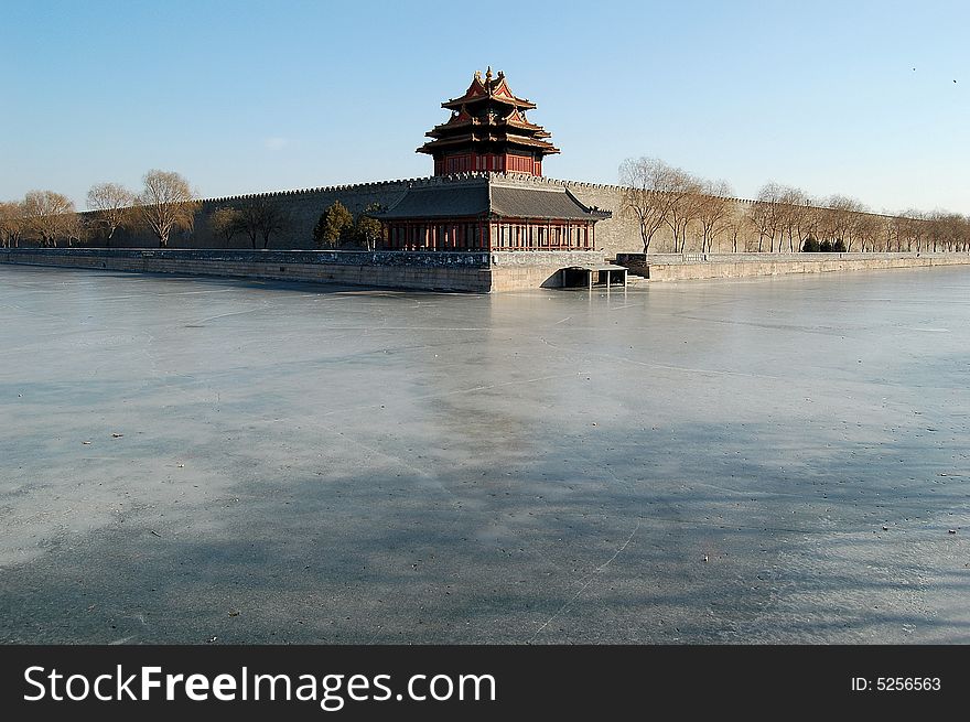 Turret and moat in the northwest corner of the forbidden city, Beijing China. Turret and moat in the northwest corner of the forbidden city, Beijing China.