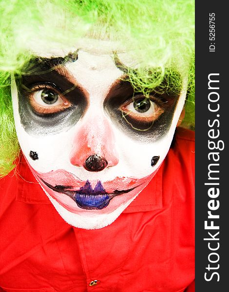 Spooky male clown in heavy stage make-up. Spooky male clown in heavy stage make-up