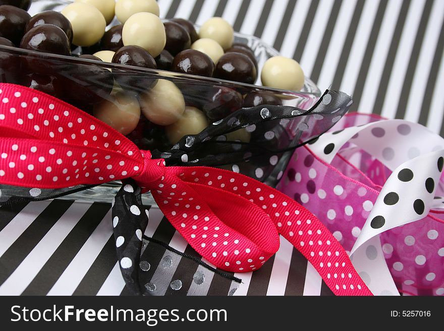 Vanilla and Dark Chocolate balls on a striped background