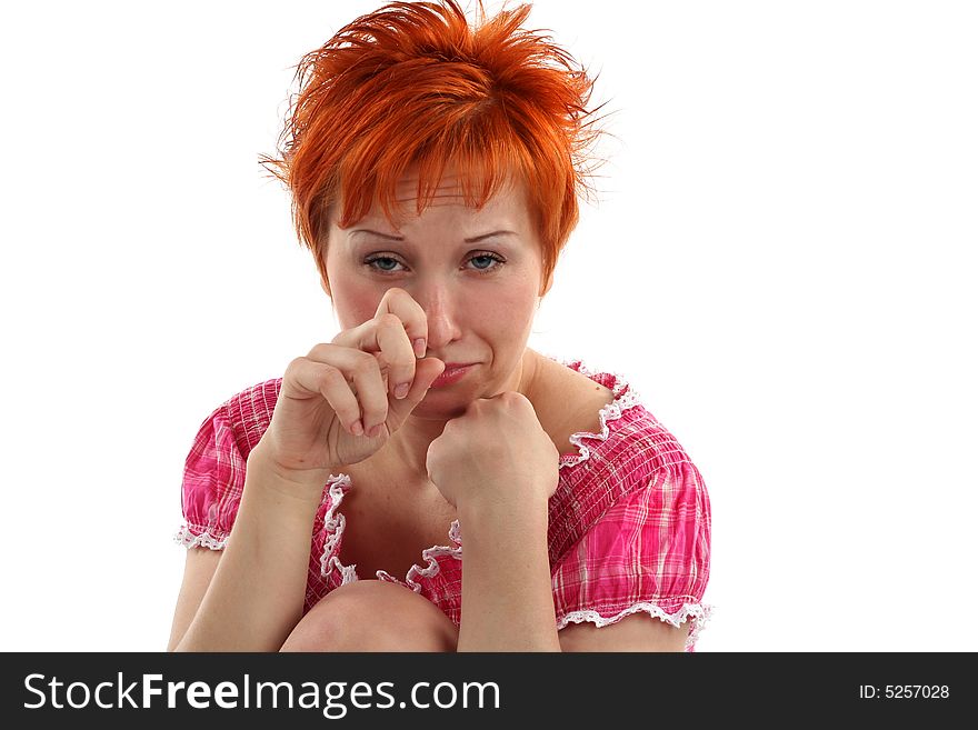 Crying young red haired woman isolated on white background