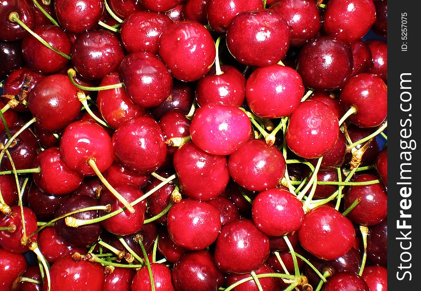 Juicy red cherries in a plate