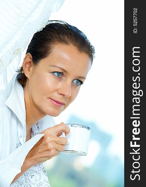 High key portrait of nice gorgeous woman drinking coffee