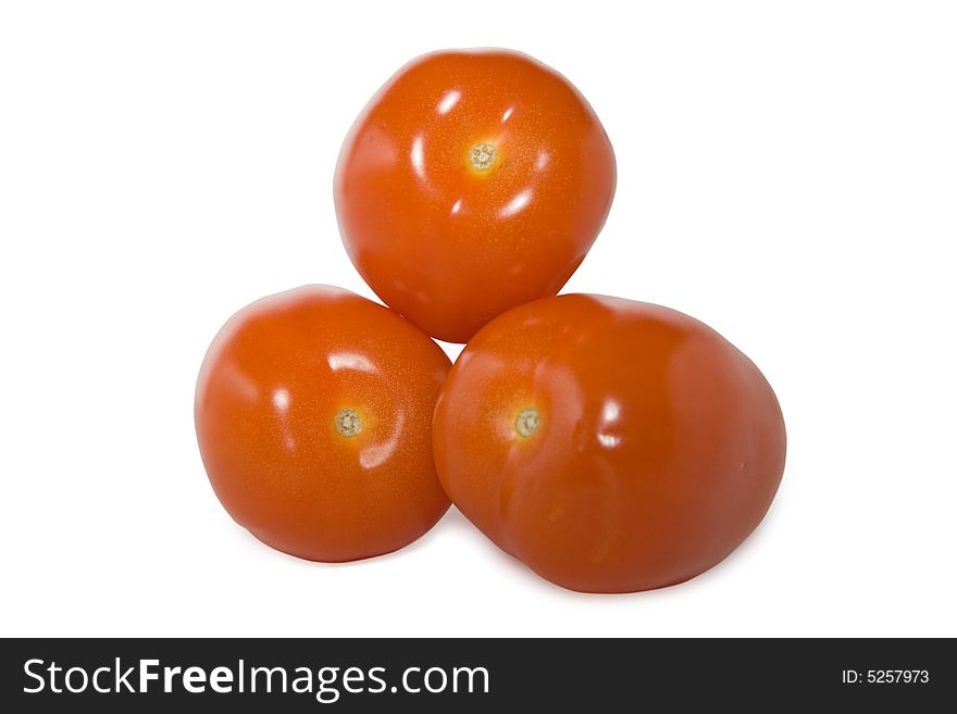 An isolated photo of three red tomatoes