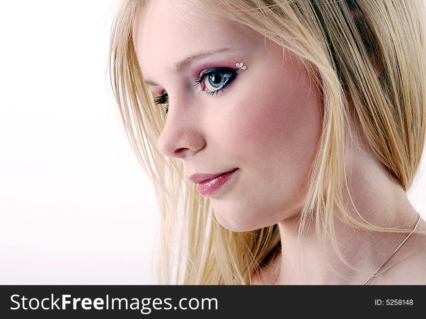 Blond girl's portrait on a white background