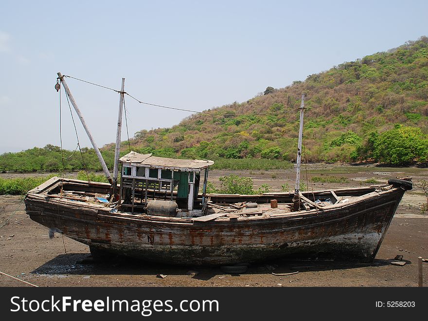 Boat on land on Elefanta Island near Mumbai. Boat on land on Elefanta Island near Mumbai