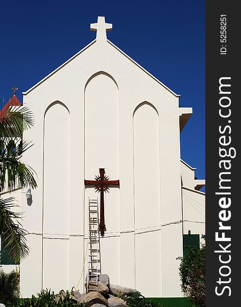 The church filled with light, with a cross and the ladder in Philipsburg town on St.Maarten island, Netherlands Antilles. The church filled with light, with a cross and the ladder in Philipsburg town on St.Maarten island, Netherlands Antilles.