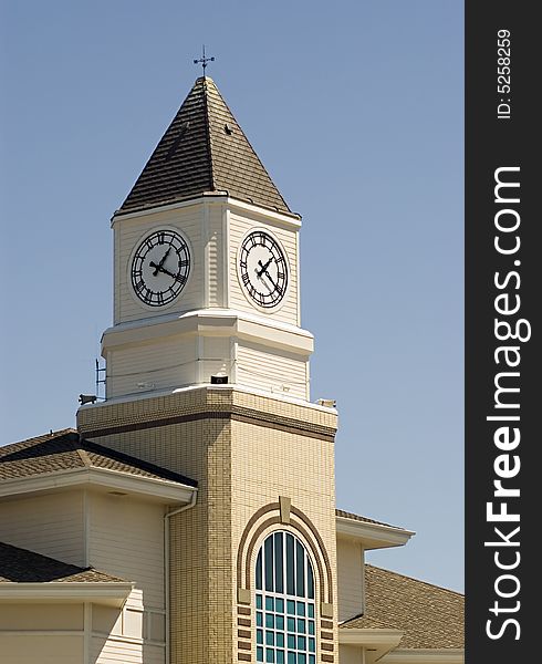 Church clock against a blue sky