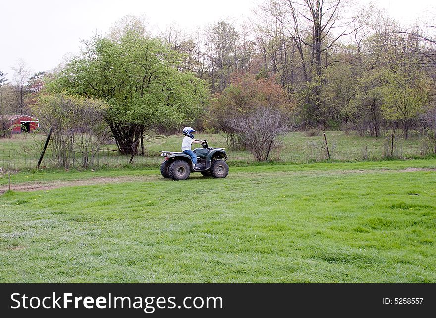 A Young Boy On A 4 Wheeler