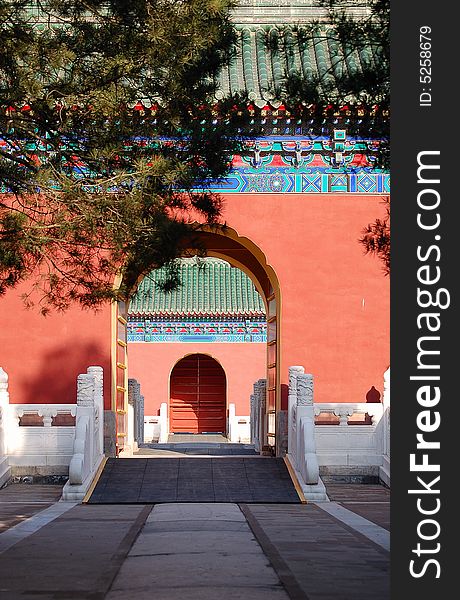 Traditional chinese red doors with beautiful decorations, shot at Temple of heaven park in Beijing China. Traditional chinese red doors with beautiful decorations, shot at Temple of heaven park in Beijing China.