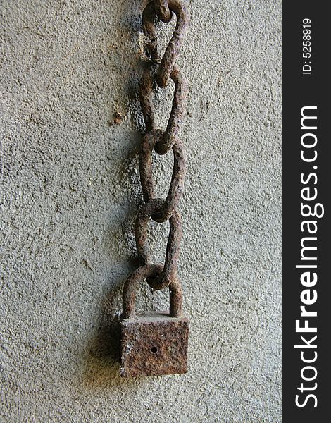 Very old lock hanged on chain