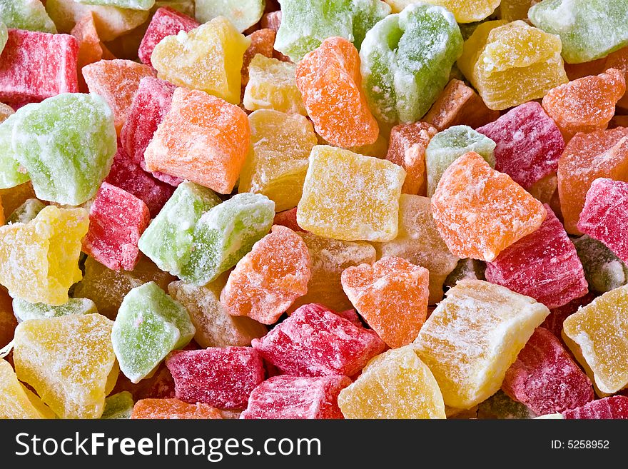 Set of multi-coloured sweet dried fruit slices close up. Set of multi-coloured sweet dried fruit slices close up