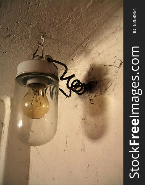 Retro bulb hanged in cellar