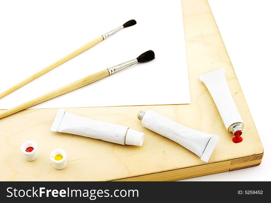 Isolated photo of moist colors and brushes. Isolated photo of moist colors and brushes