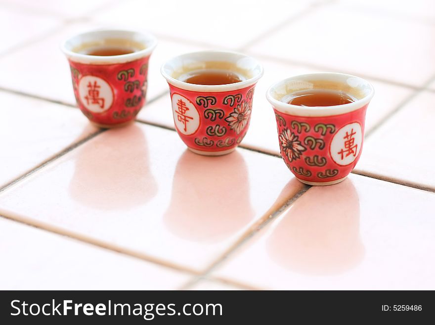 Threes cups of tea for sacrificial offerings. Threes cups of tea for sacrificial offerings.