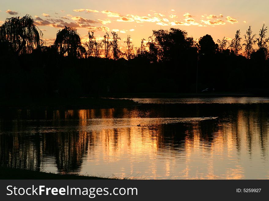 Black and Orange sunset at a lake. Black and Orange sunset at a lake