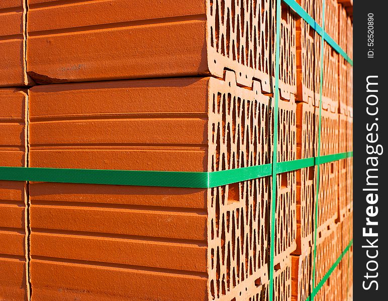 Stack of red bricks for the construction closeup outside. Stack of red bricks for the construction closeup outside