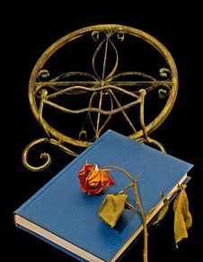 Dried-out Rose On Book And Bookstand Royalty Free Stock Image Dried-out Rose On Book And Bookstand Royalty Free Stock Image