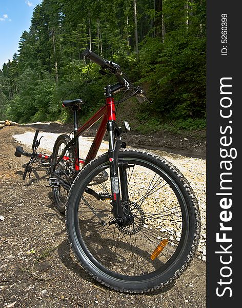 A red mountain bike resting. A red mountain bike resting