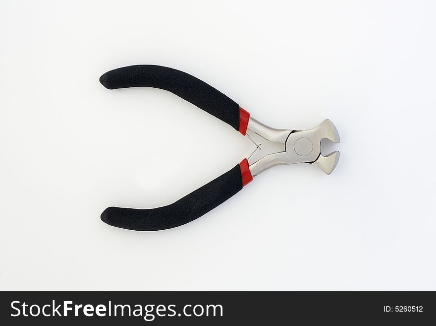 A pair of end cutting pliers, chromed with black rubber handles. A pair of end cutting pliers, chromed with black rubber handles