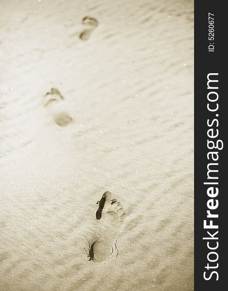 Footprints in sand, selective focus. Footprints in sand, selective focus.