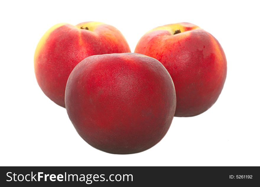 Isolated fresh peaches on white background