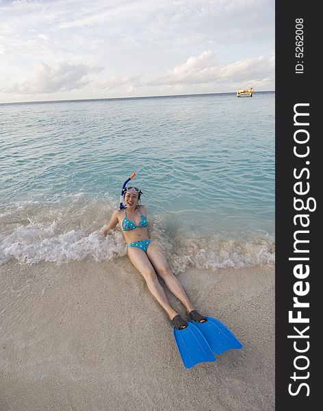 Girl on the beach with snorkeling mask. Girl on the beach with snorkeling mask.
