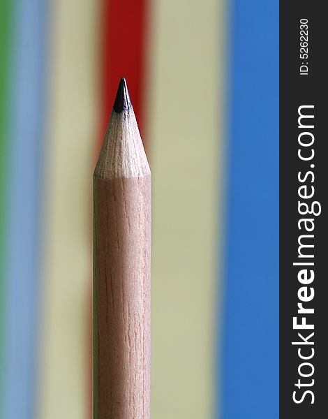 A  pencils with a simple colorful background. A  pencils with a simple colorful background
